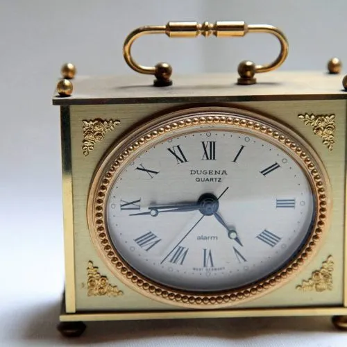 small quartz metallic clock